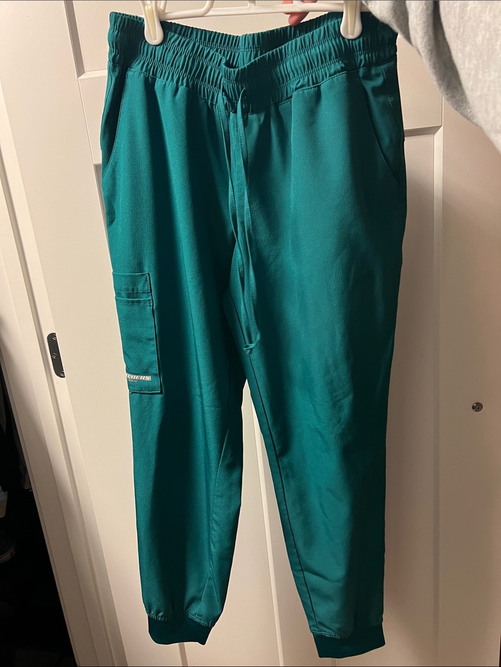 Green Skechers scrub pants